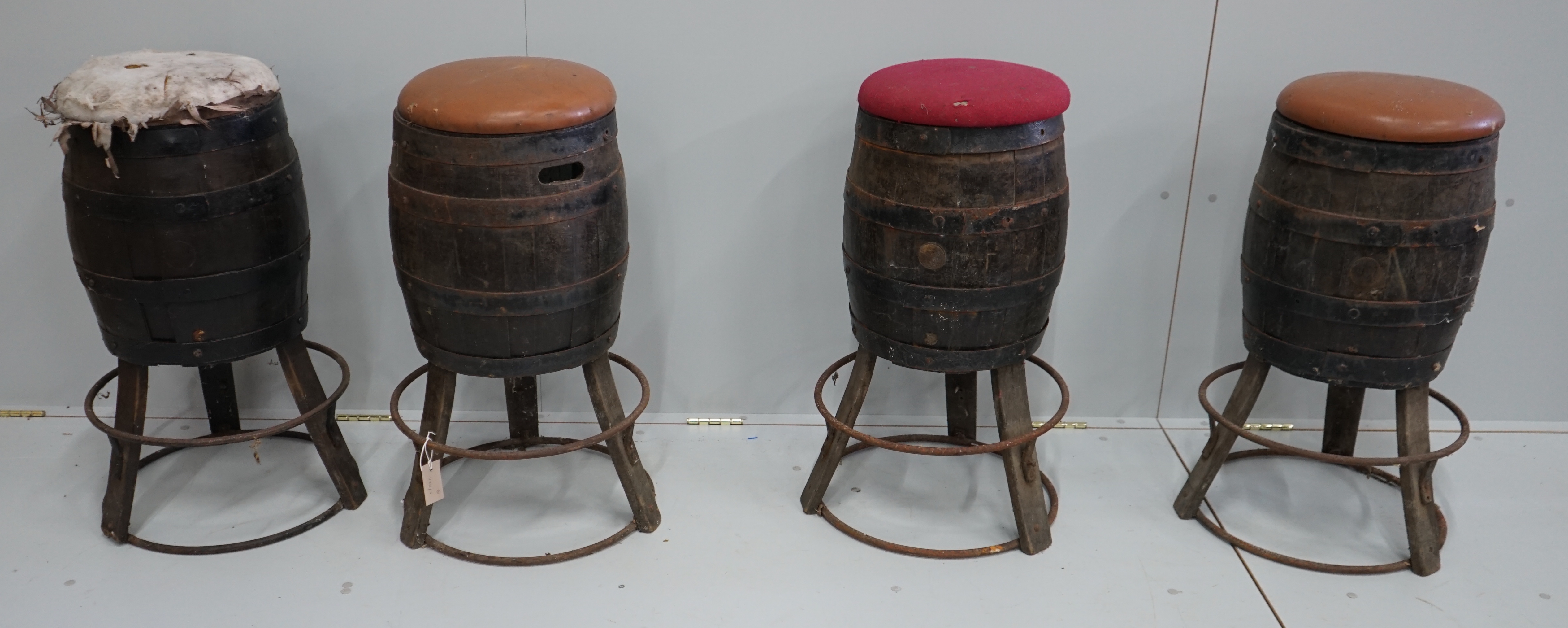 A set of four barrel bar stools, height 73cm